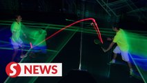 Glow-in-the-dark badminton entices Malaysian players