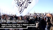 Taliban hoist giant flag in Afghan capital, eight months after return