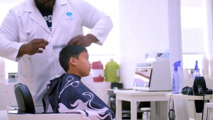 Dubai Autism Centre: Child getting haircut