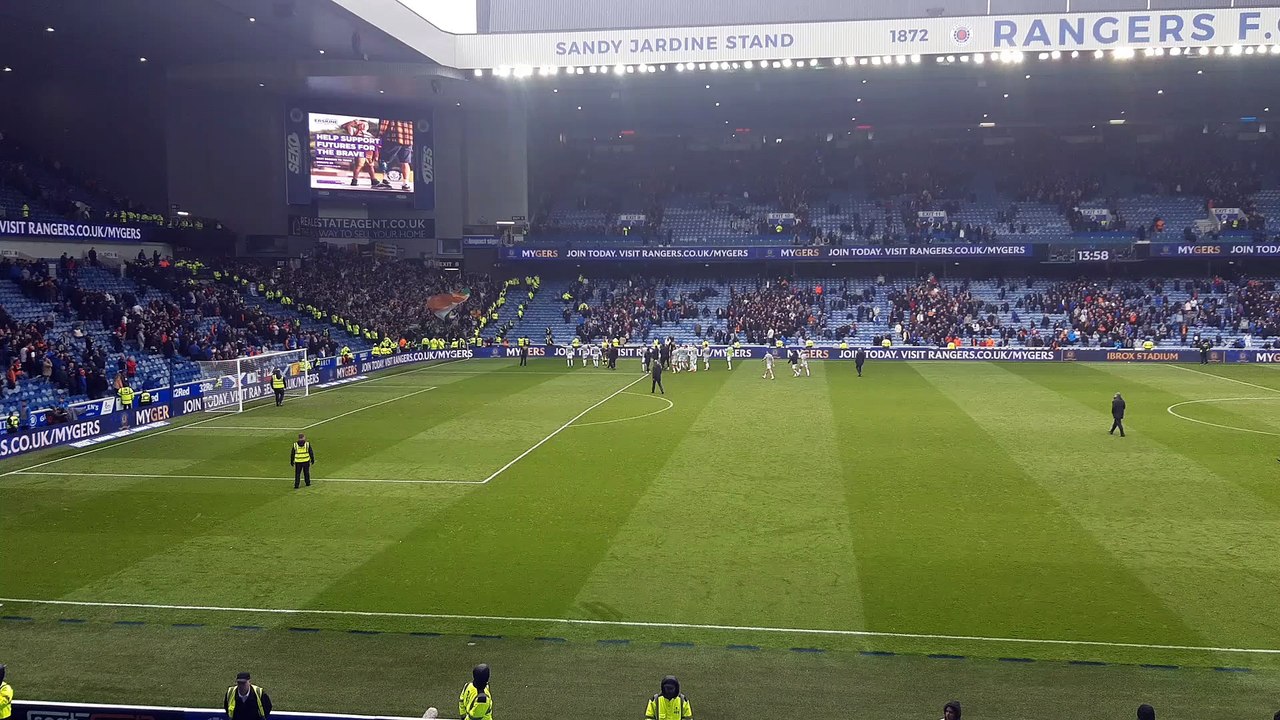 Celtic players with fans at full time