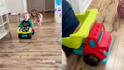 1 y/o boy flips out of his dump truck after sister gives him a hard push