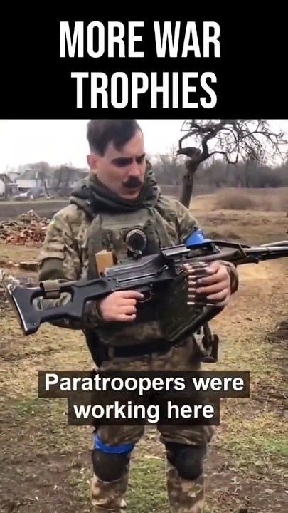 TROPHY MACHINEGUN- Ukrainian soldier displays a Russian PKP machinegun