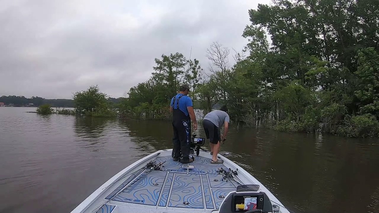 Father Hooks Son's Hat while Fishing