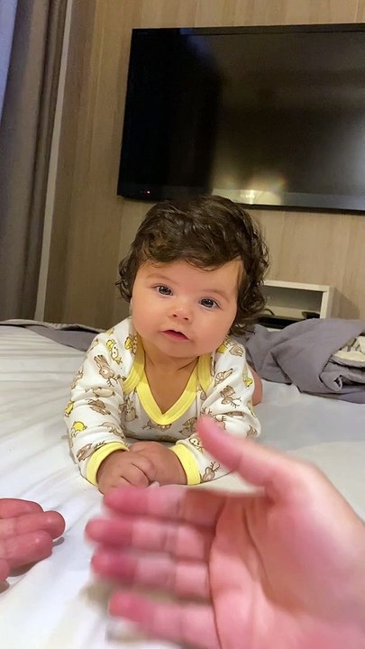 Baby Can't Decide Between Mom or Dad's Hand