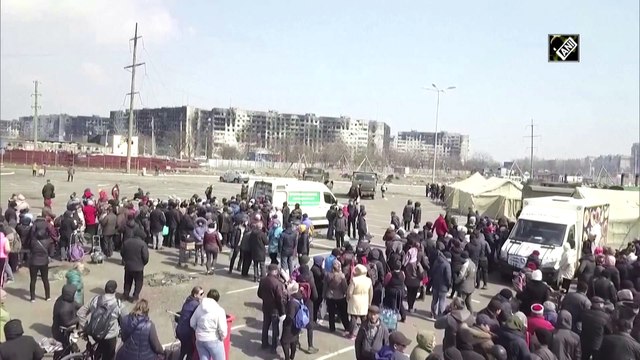 Ukraine crisis: People queue up in besieged city of Mariupol for humanitarian aid