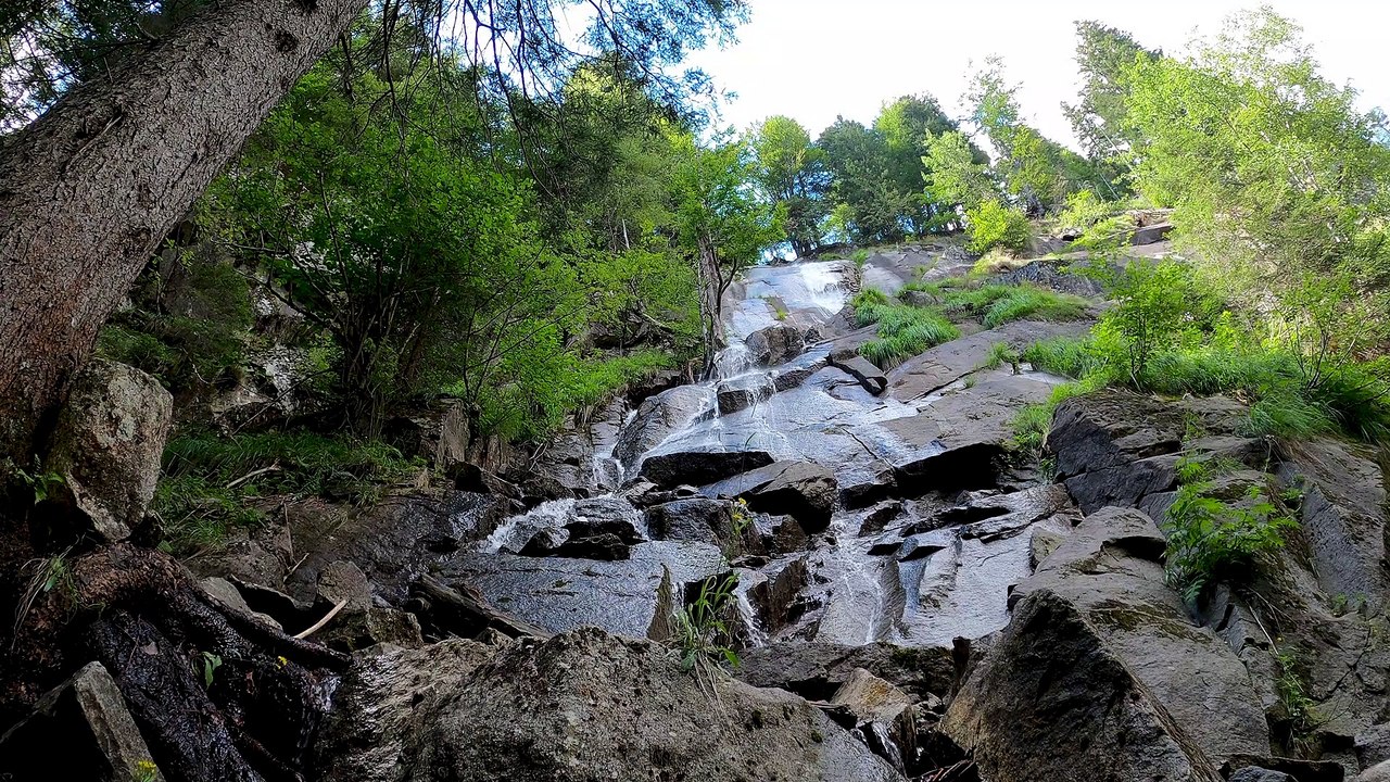SMALL WATERFALLS ON MOSSY ROCKS