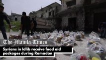 Syrians in Idlib receive food aid packages during Ramadan