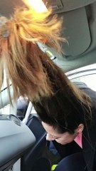 Woman With Troll Hair Struggles to Get into Car