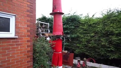 UK's strongest granddad John Evans balances a 14st crown on his head for his 100th world record - aged 75