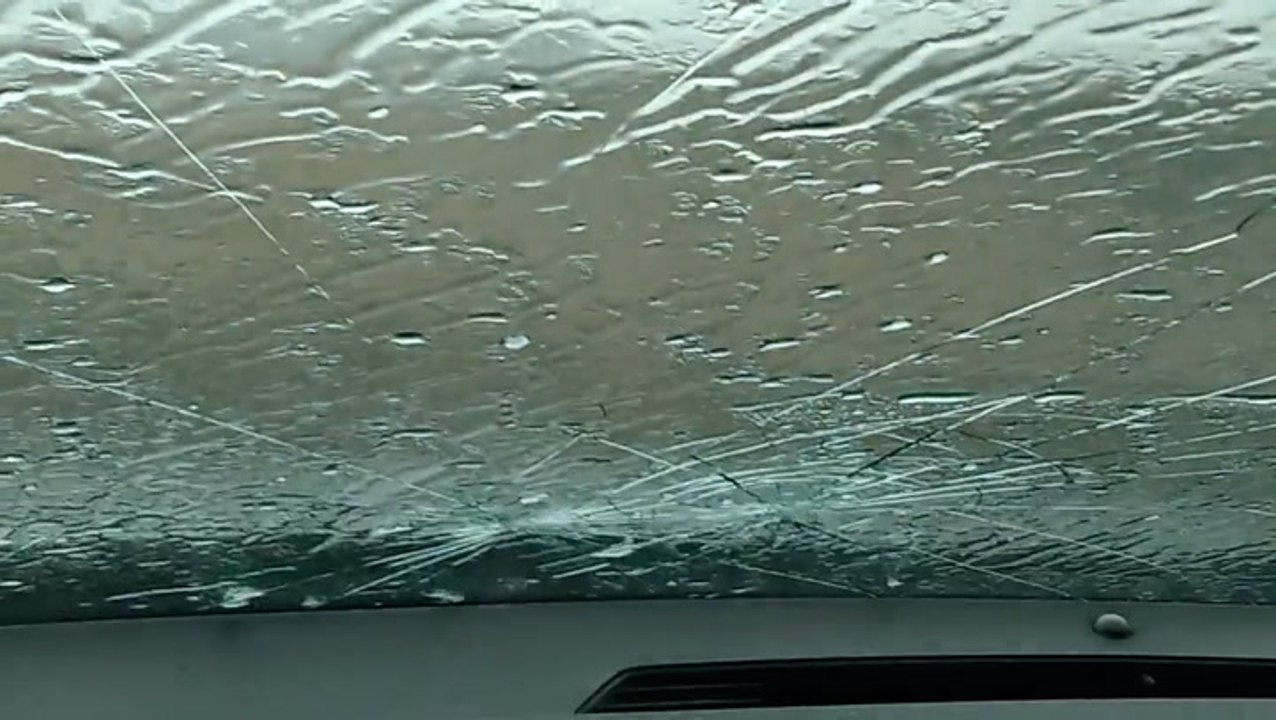 Large hail cracks storm chaser's window
