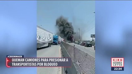 Queman camiones para presionar a transportistas por bloqueo