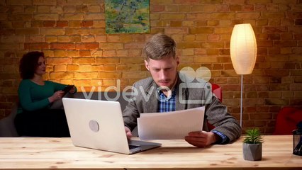The businessman and a businesswoman working with a sensor screen