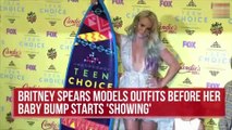 Britney Spears models outfits before her baby bump starts to show