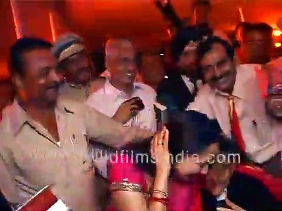 Hema Malini sits next to Dev Anand, Dev Anand holds her hand...