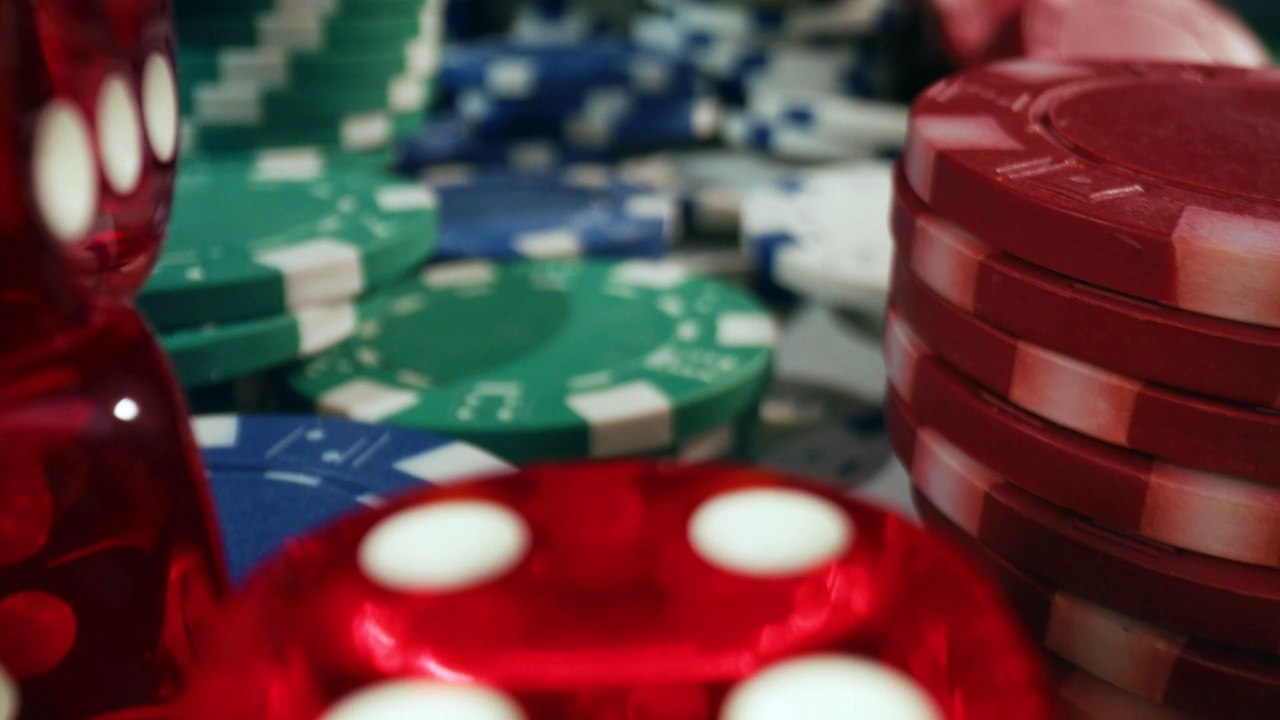 mixkit-lots-of-chips-and-dice-arranged-on-a-game-table-42931