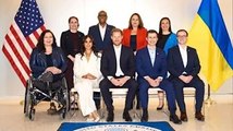‘Glowing’ Meghan and Harry pose with US delegation at Invictus Games in new snaps