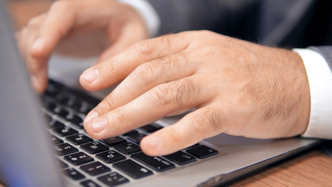 hands-of-a-man-typing-on-a-laptop-4827