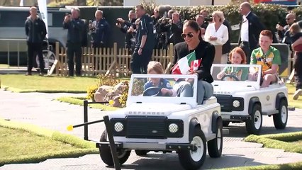 Children take Harry and Meghan for a spin at Invictus Games