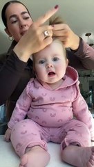Sweet Baby - Baby smiles when mommy ties her hair