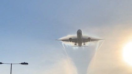 Plane carves right through fog in England