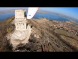 Person Paraglides Near Majestic Castle Ruins In Czech Republic
