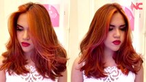 Trasformazione nella colorazione dei capelli della modella con un bel rosso