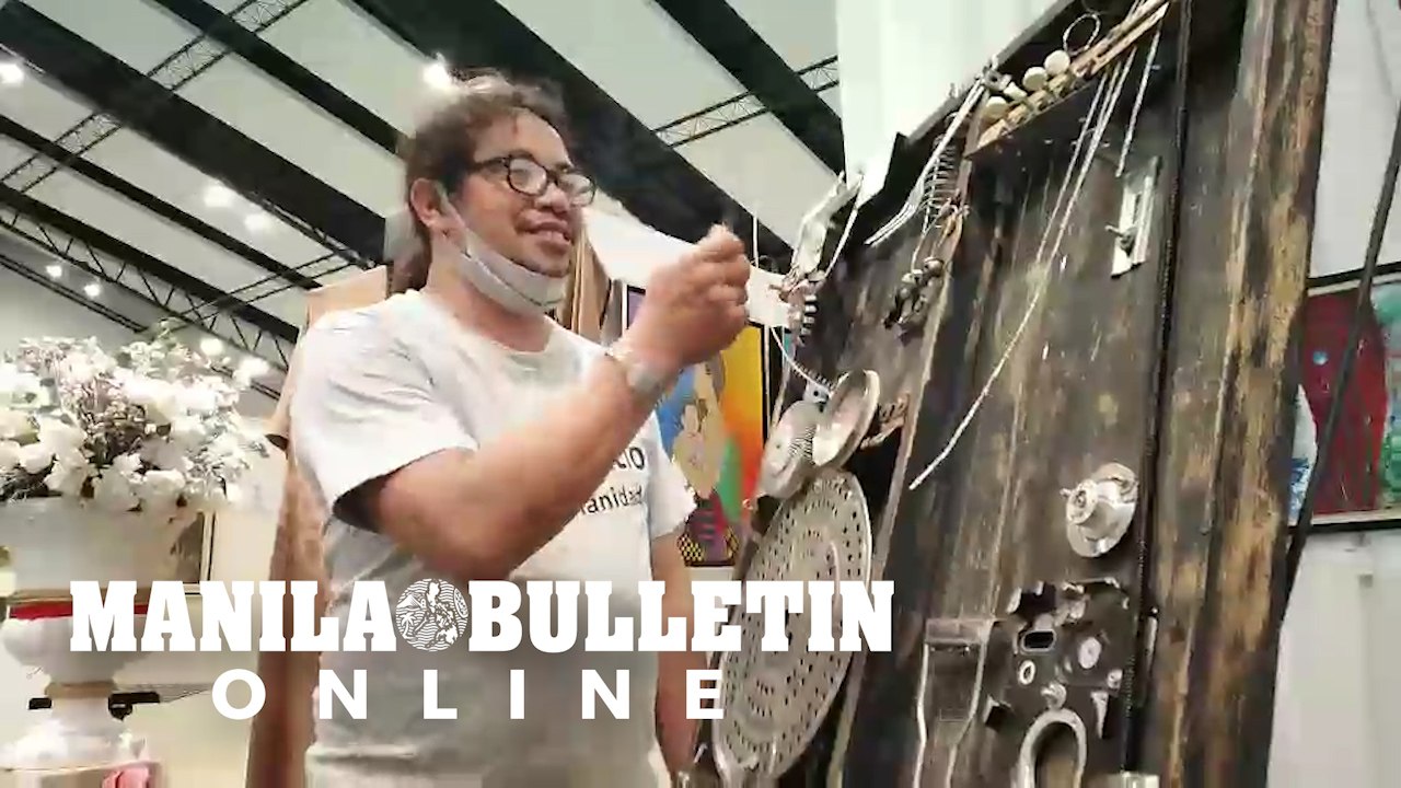 Artist Noy Narciso demonstrates his improvised musical instruments in