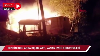 Kendini son anda dışarı attı, evinin yanışını görüntüledi