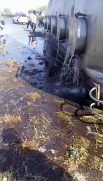 When the tanker overturned, villagers reached with buckets to collect chemicals