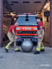 Firefighters perform routine with exercise ball