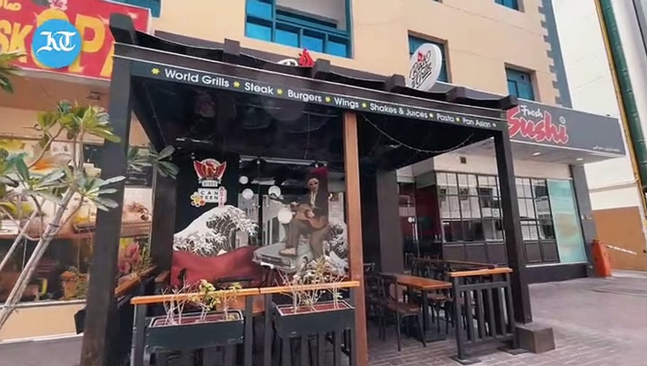 Restaurant staff demonstrates cleaning and cooking process