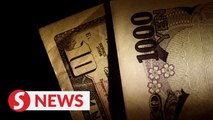 BOJ doubles down on stimulus, sends yen skidding