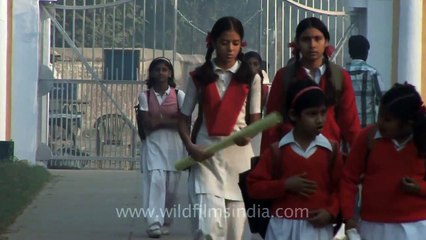School students walk past Basilica of Our Lady Of Graces