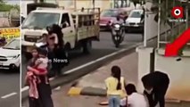 Mother Daughter Saves Unconscious Traffic Police Officer , Video Goes Viral