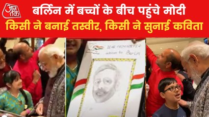 PM interacted with kids in Berlin, girl presented a portrait