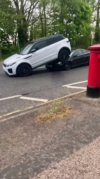 Car Stuck Under SUV