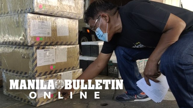 Voting machines and ballot boxes ready to be distributed to voting precincts in Manila