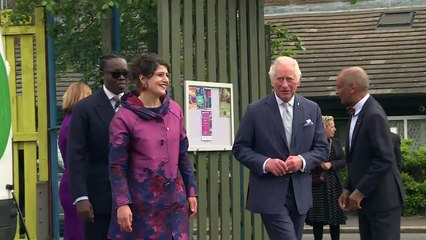 Charles throws American football on Brixton foundation visit