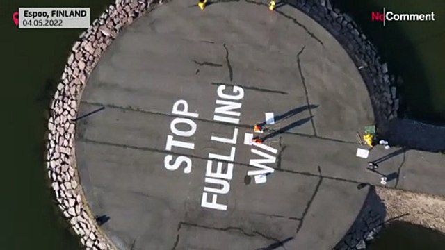 Finland: Greenpeace activists hang anti-war banner on power firm Fortum`'s HQ