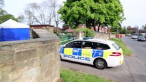 Police officers were today stood guard at a city centre cemetery after it was discovered that a grave had been partially dug up.