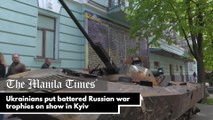 Ukrainians put battered Russian war trophies on show in Kyiv