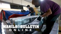 Workers deliver Comelec ballots from the Manila City hall to schools and polling precincts