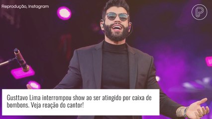 Gusttavo Lima é atingido por caixa de chocolates em show e momento inusitado viraliza. Veja reação!