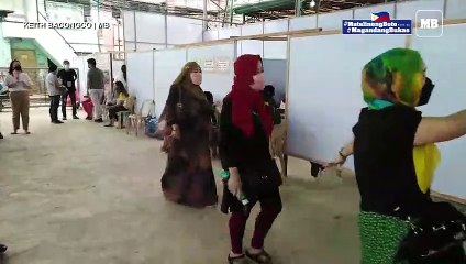 Residents troop at a makeshift voting precinct in Davao City