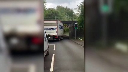 Van attempts to drive under Prescott Street bridge