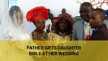 Father gifts daughter Bible at her wedding