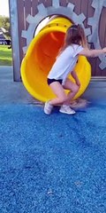 Siblings Have Different Methods Going Down Slide
