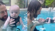 'This video of an infant learning to stay afloat is both IMPRESSIVE & PEAK CUTENESS '