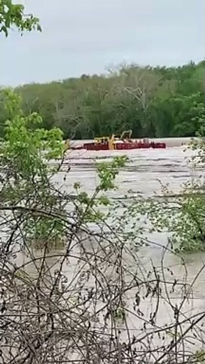 Loose Barge Rolls Over Dam
