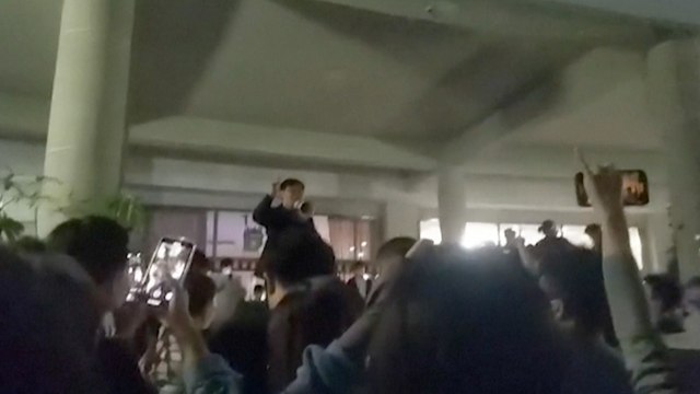 Beijing students protest Covid-19 curbs on campus in rare act of defiance